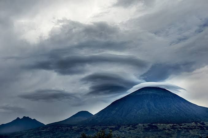 Dramatic lenticular clouds over a volcano