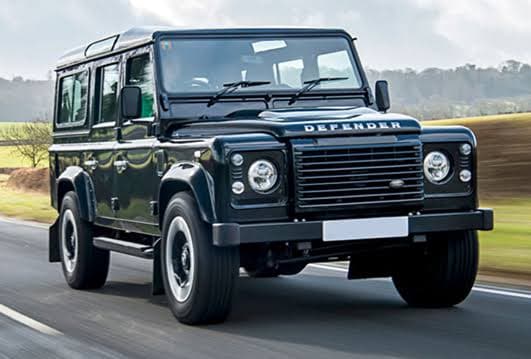 Dark green Land Rover Defender used for safaris in Rwanda