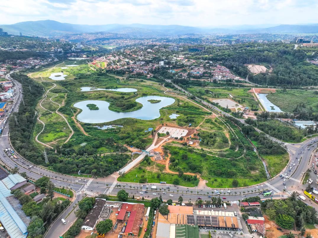 Aerial view of a lake and neighbourhood in Kigali
