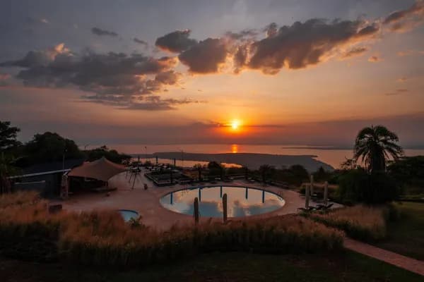 Sunset over the lake from an Akagera lodge shoreline